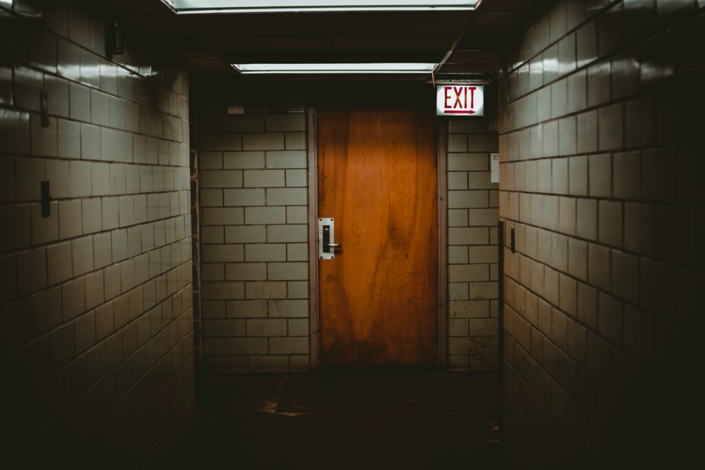 a poorly lighted apartment hallway